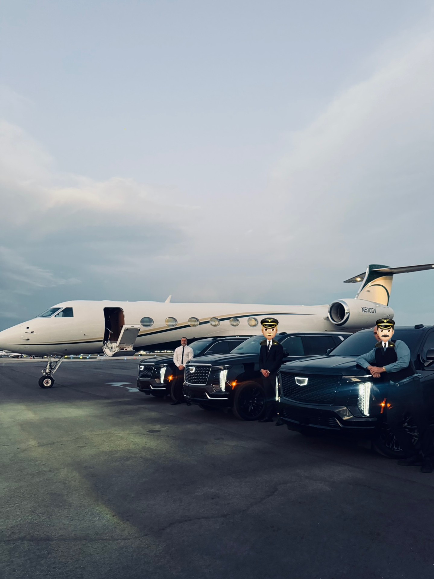 Black Cadillac Escalade fleet beside private jet at runway